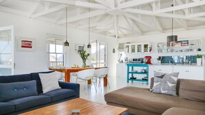 Business Villa, 4 Bedrooms | Living room | Flat-screen TV - Gannet Beach House (Cape Town)