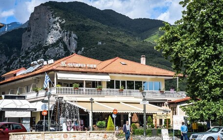 A building with a balcony and a sign that reads "View."