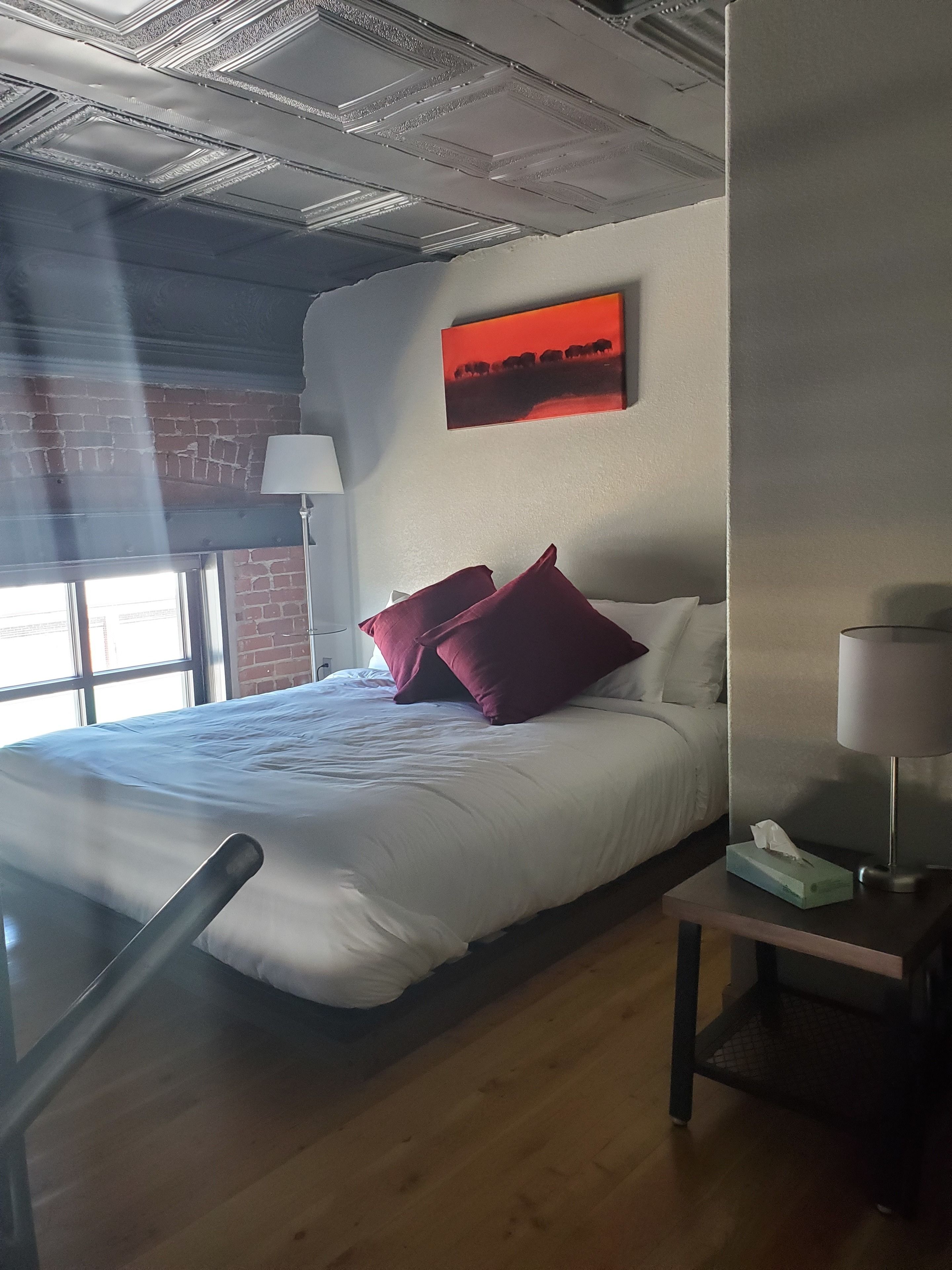 premium bedding, desk, laptop workspace, blackout curtains