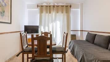 Standard Apartment, Multiple Beds | Living area | 32-inch Smart TV with cable channels