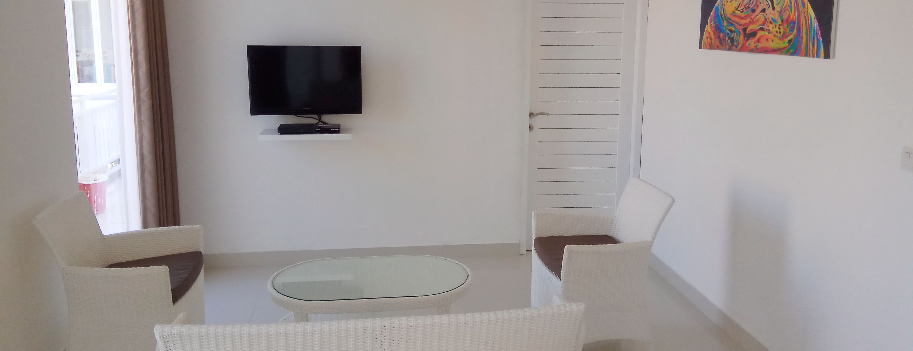Family Apartment, 1 Bedroom, Non Smoking | Living room | 32-inch flat-screen TV with satellite channels, TV, DVD player