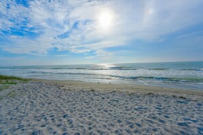 On the beach, sun-loungers, beach towels