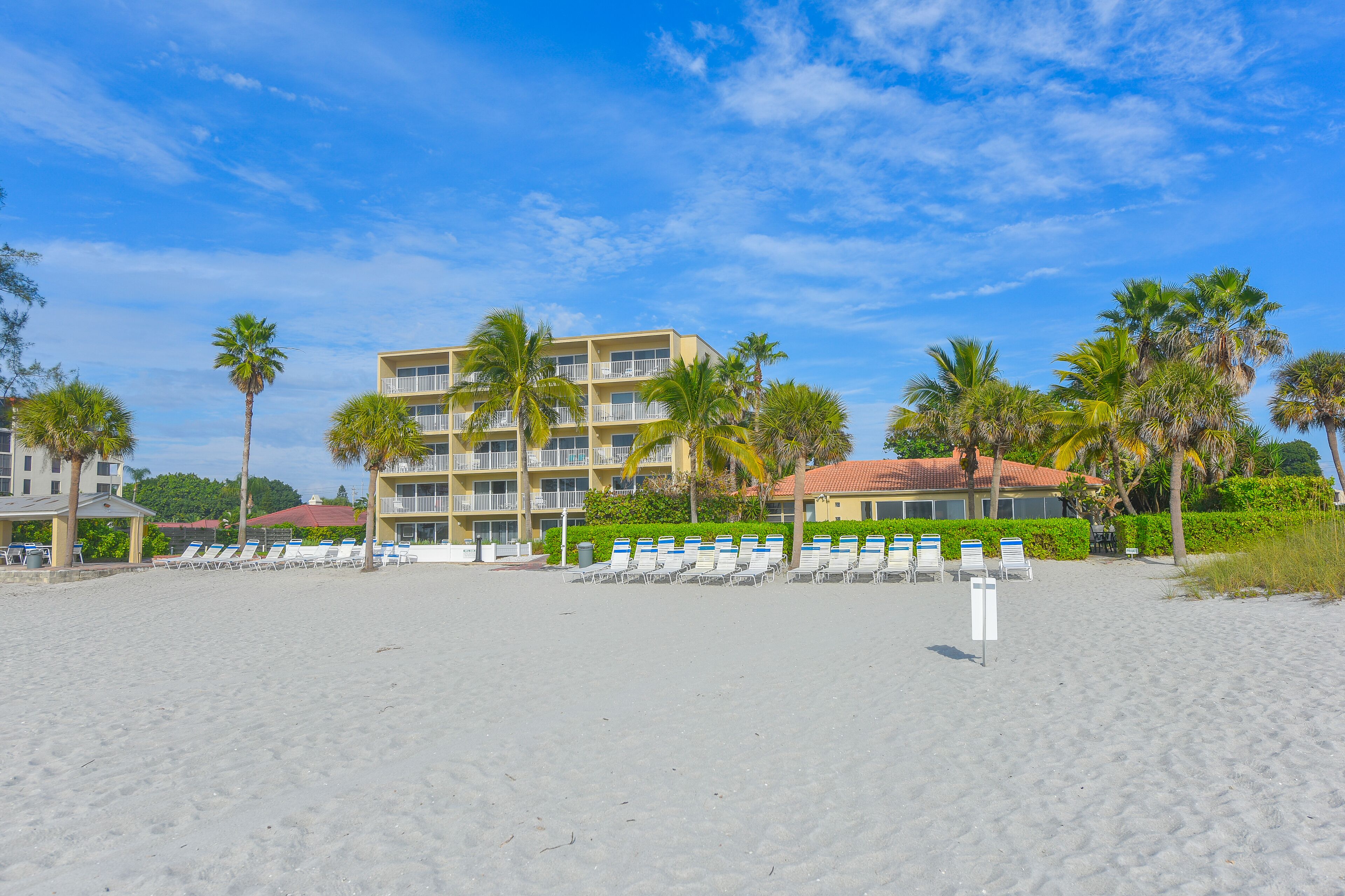 On the beach, sun loungers, beach towels