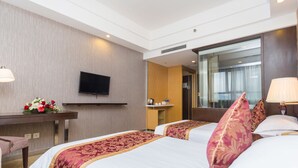 A hotel room with two beds, a desk with a flat-screen TV, a mirror, and a bathroom visible through an open door. - Shanghai Pudong Airport Yueshangju Hotel (Shanghai)