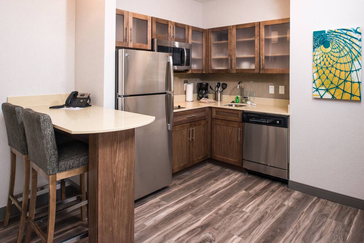 full-sized fridge, microwave, stovetop, dishwasher