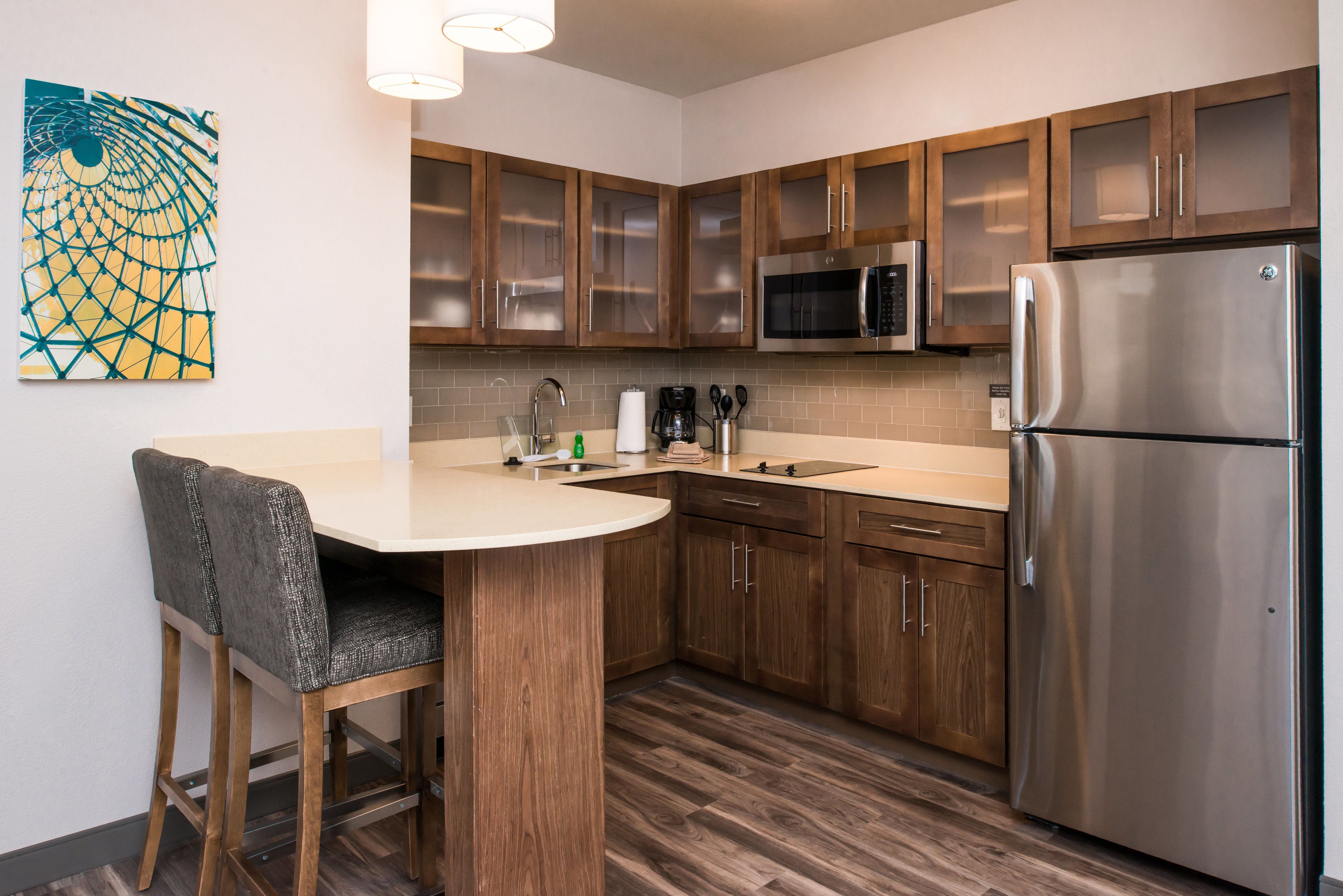 full-sized fridge, microwave, stovetop, dishwasher