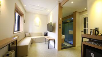 Deluxe Suite (Family) | Living area | 55-inch LED TV with digital channels, TV, Netflix