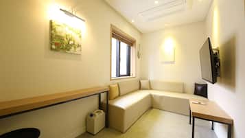 Deluxe Suite (Family) | Living area | 55-inch LED TV with digital channels, TV, Netflix