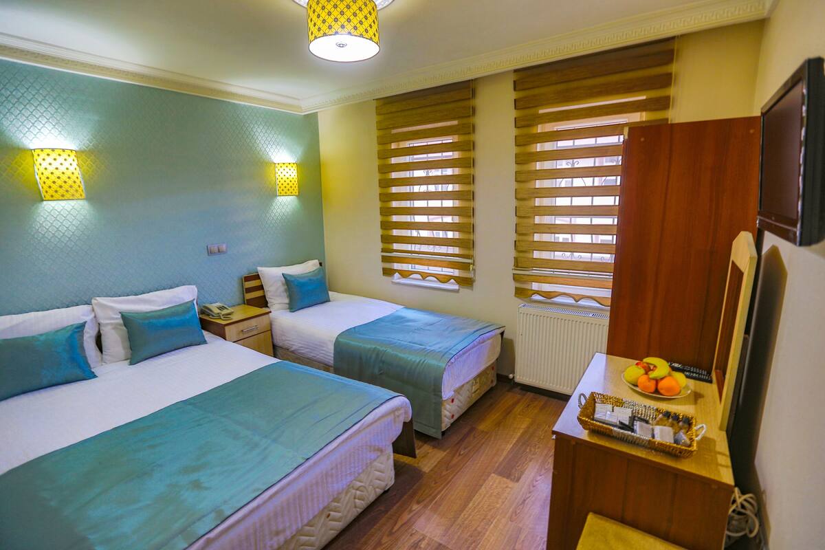 Family Triple Room, 1 Bedroom, Non Smoking, City View | Soundproofing, WiFi (free), bed sheets