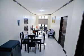 Deluxe Room | Living room | 29-inch LCD TV with cable channels, TV - Twin B Residences (Kalibo)
