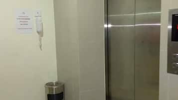 Shower, rainfall showerhead, towels