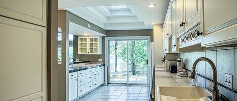 Full-sized fridge, microwave, stovetop, dishwasher