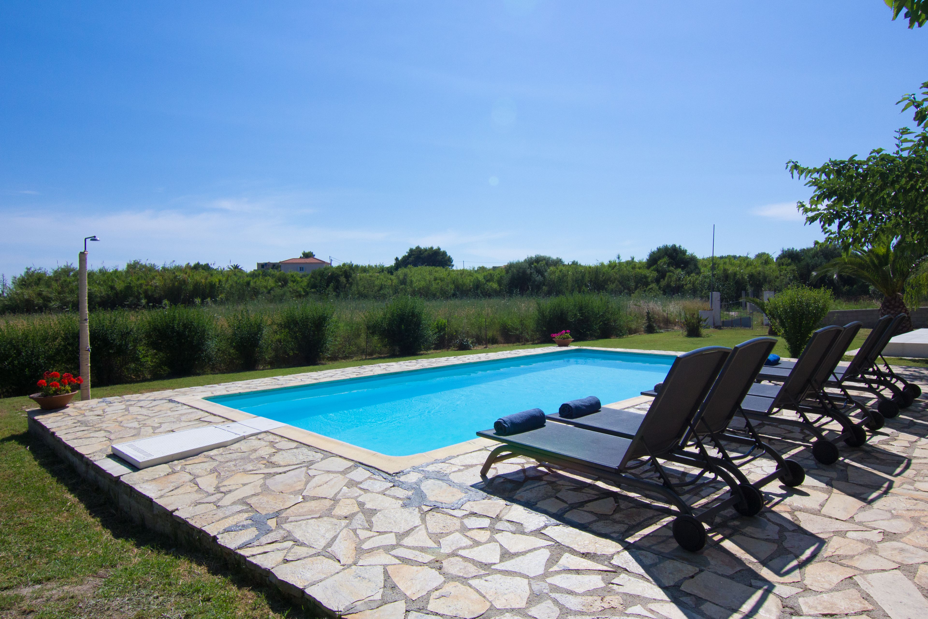 Outdoor pool, pool umbrellas, sun loungers