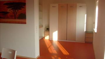 Basic Apartment, Multiple Beds, Non Smoking, Garden View | Living area | Flat-screen TV