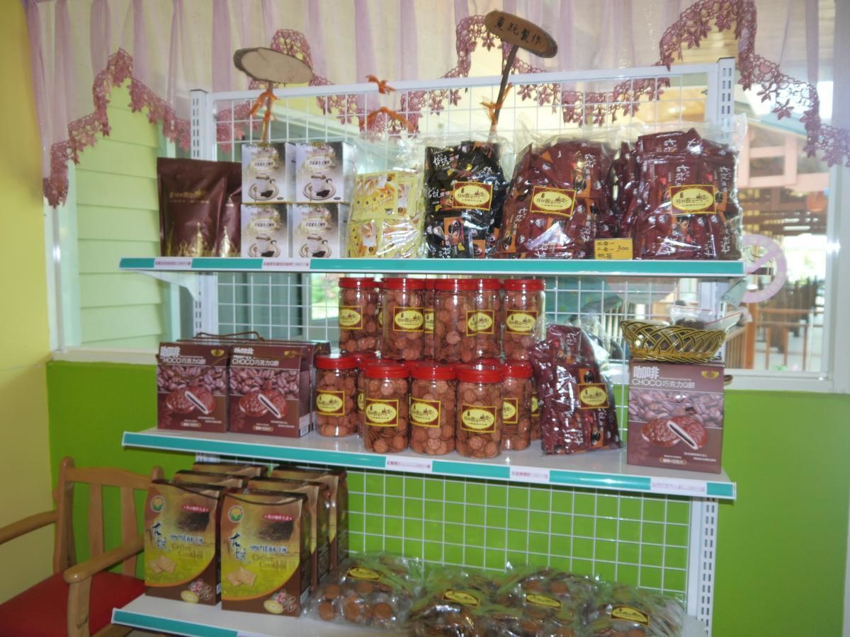 A shelf stocked with various packaged goods, including jars and boxes, likely in a store or market setting.