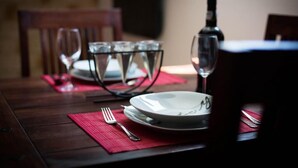 A dining table set with plates, glasses, and cutlery. - Villa Mia (Dubrovnik)