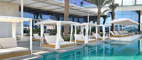 Outdoor pool, open 8:00 AM to 9:00 PM, free cabanas, pool umbrellas