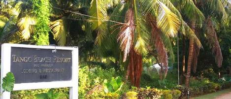 A sign for Tango Beach Resort, indicating it offers lodging and a restaurant.