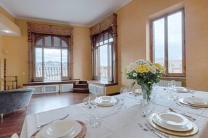 Enjoy meals in style with a beautifully set dining table, overlooking the city.