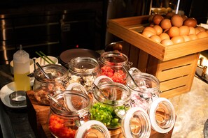 A breakfast buffet with various food items and condiments. - Pullman Shanghai Qingpu Excellence (Shanghai)