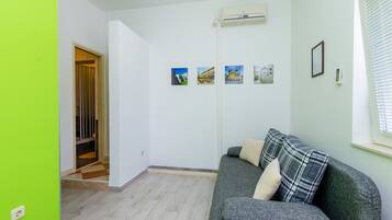 Apartment, 1 Bedroom, Terrace | Living area | Flat-screen TV