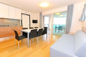 Apartment, 2 Bedrooms (CX7) | Living area | 23-inch TV with satellite channels - Residence Sky (Lignano Sabbiadoro)