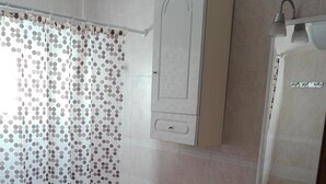 A bathroom with a toilet, sink, and shower area. - LARGE TERRACE 60 M2, SEA VIEWS. Wi-Fi exclusive (Isleta del Moro)