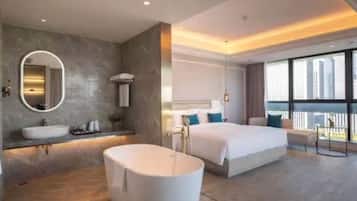 Habitación ejecutiva, 1 cama King size | Baño | Regadera, regadera tipo lluvia, amenidades de baño gratuitas