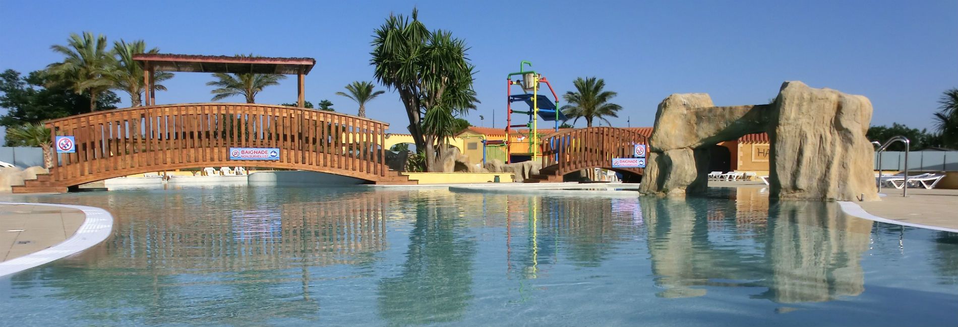 Indoor pool, outdoor pool, open 10:00 AM to 6:00 PM, pool umbrellas