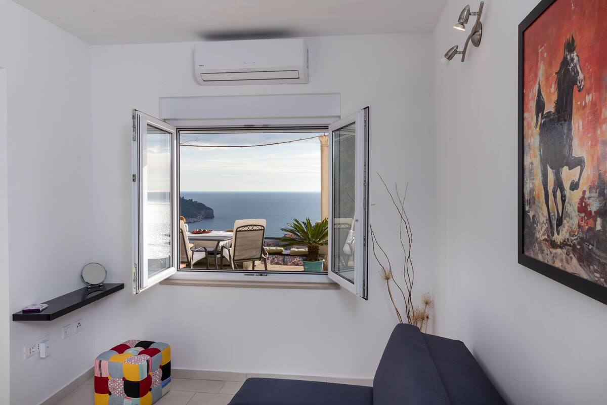Apartamento superior, 1 quarto, terraço, vista para o mar | Área de estar