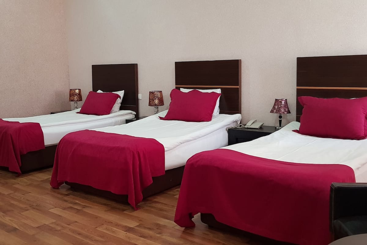 Deluxe Triple Room, 1 King Bed, Smoking | In-room safe, soundproofing, iron/ironing board, free WiFi
