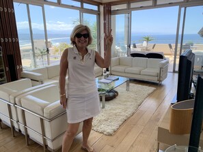 Luxury Apartment, 3 Bedrooms, Ocean View | Living area | Flat-screen TV, books