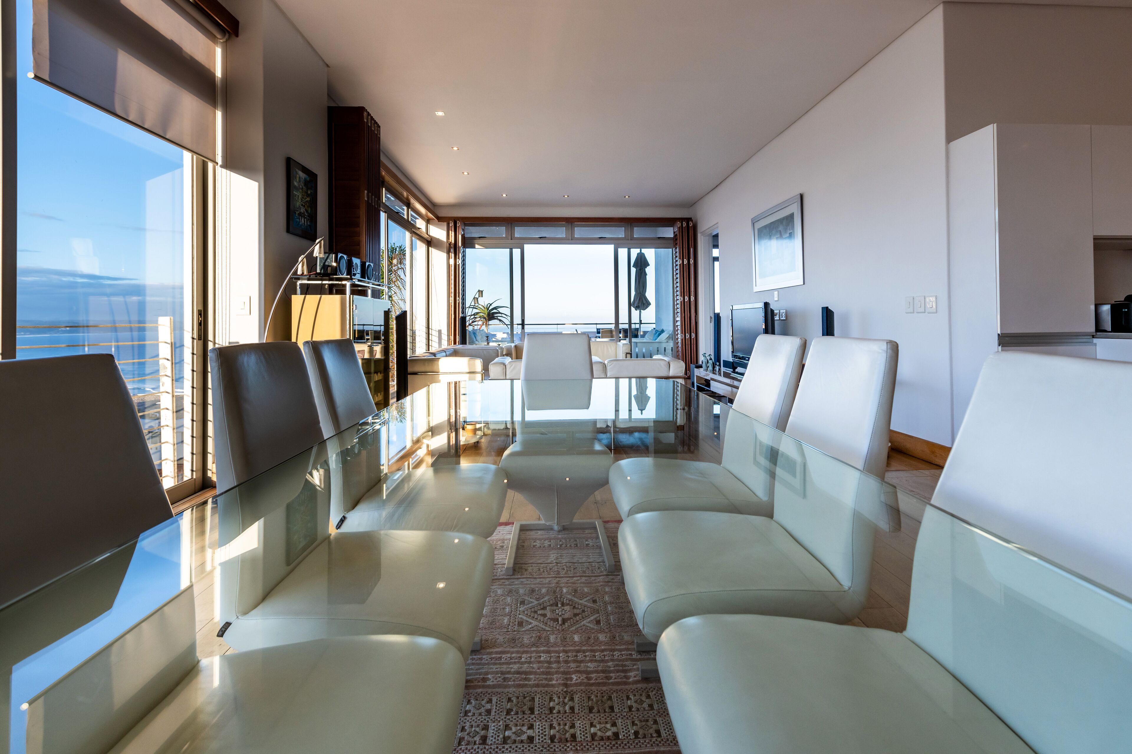 Luxury Apartment, 3 Bedrooms, Ocean View | Living area | Flat-screen TV, books