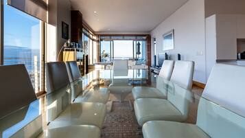 Luxury Apartment, 3 Bedrooms, Ocean View | Living area | Flat-screen TV, books