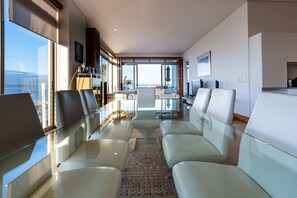 Luxury Apartment, 3 Bedrooms, Ocean View | Living area | Flat-screen TV, books