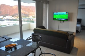 32-inch flat-screen TV with cable channels, Smart TV