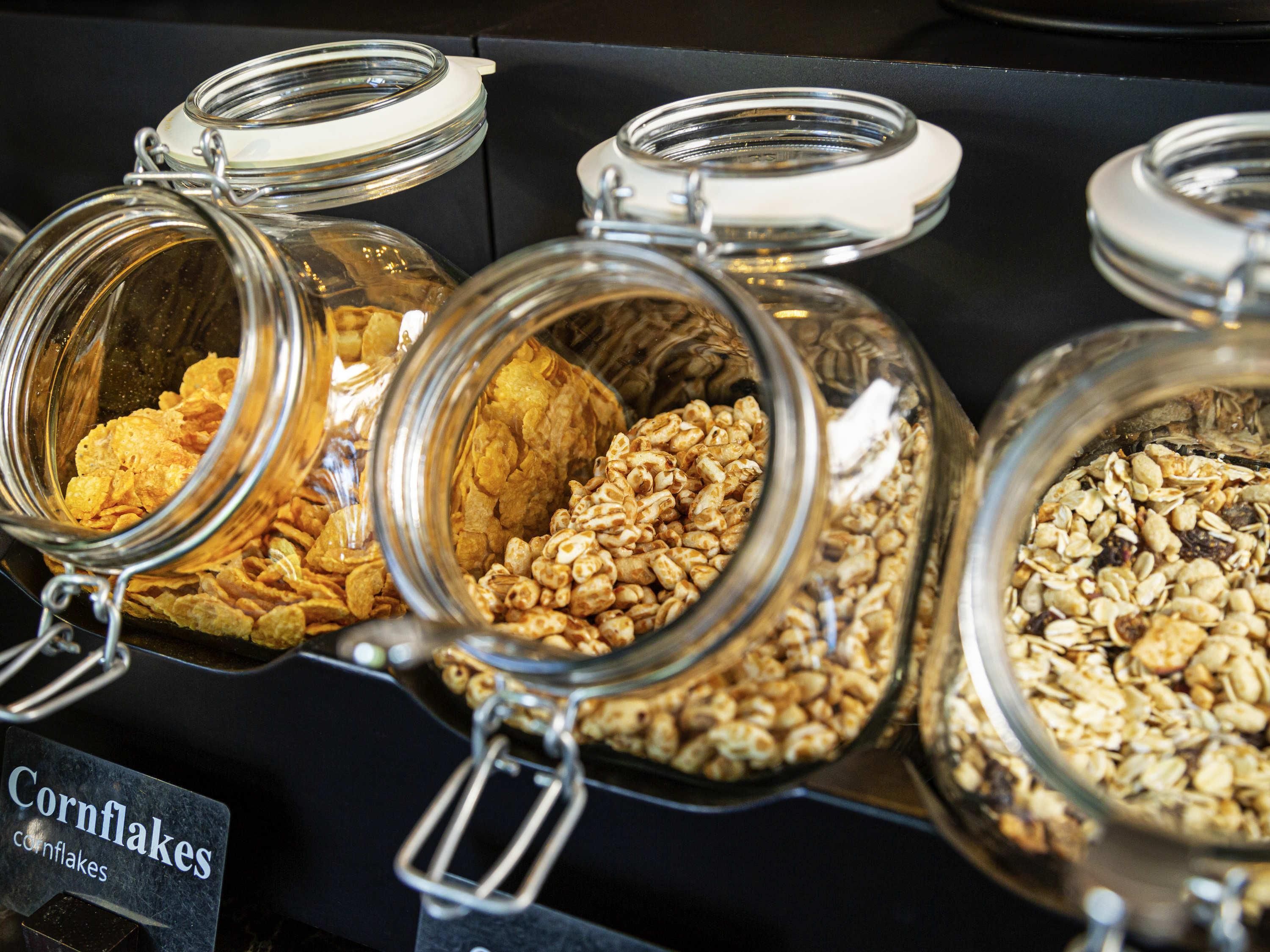 Glass jars with metal lids containing various food items.