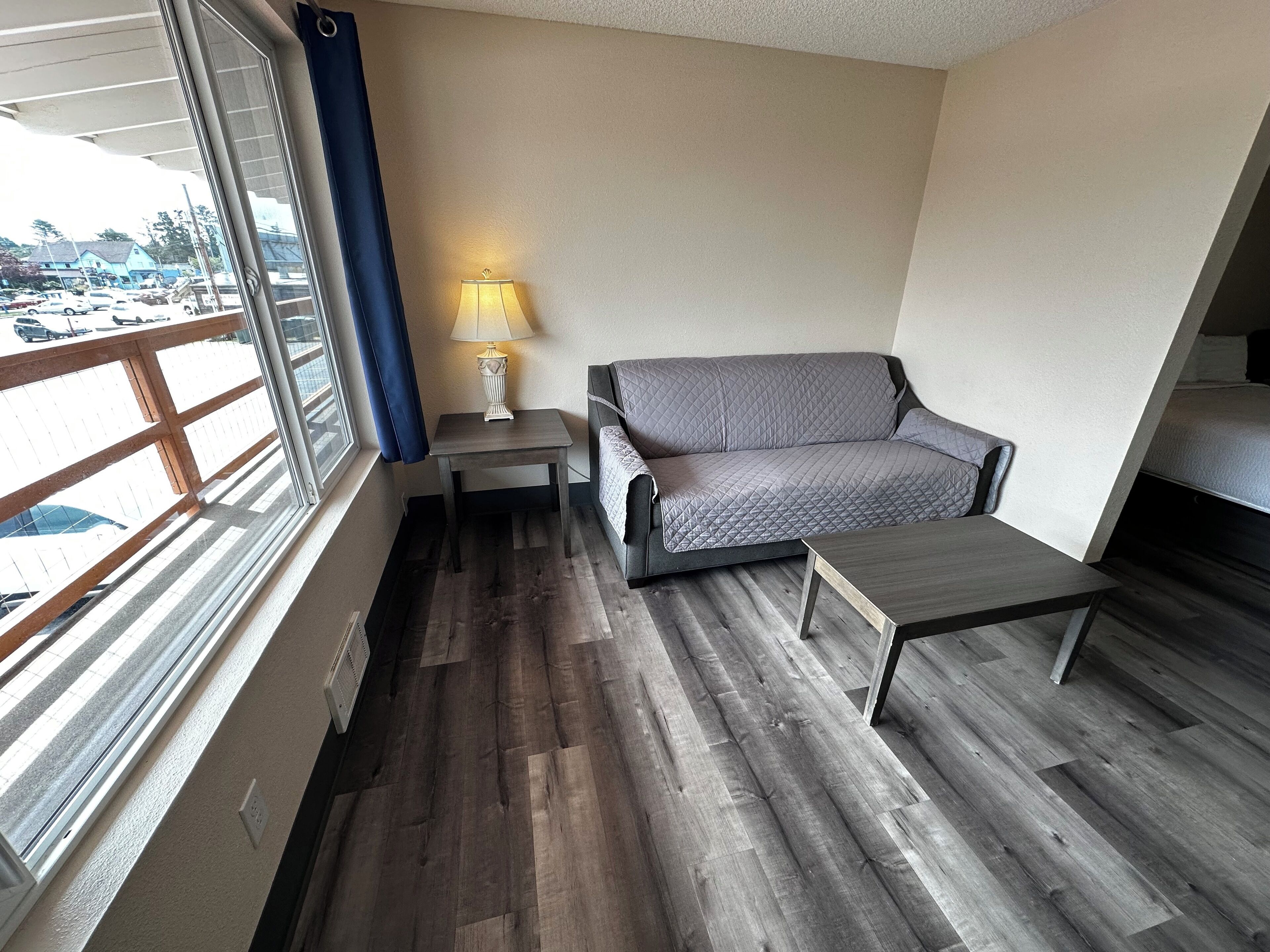 queen studio with sofa sleeper, kitchenette | living room | 49-inch lcd tv with satellite channels, tv