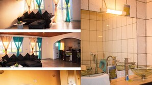 A hotel room with a sofa, a bed, a kitchen area, and a bathroom. - Résidence hôtelière Borel Douala (Douala)