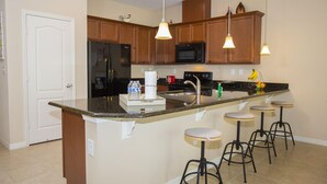 House, Multiple Beds (Villa Compass- Compass Bay) | Private kitchen | Coffee/tea maker, fridge, oven, stovetop - Villa Compass 4 Bedroom Bedroom Apartment (Kissimmee)