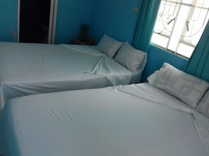 Standard Quadruple Room, 2 Double Beds, Smoking | Minibar, free WiFi, bed sheets