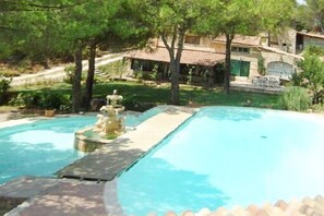 An infinity pool, pool loungers