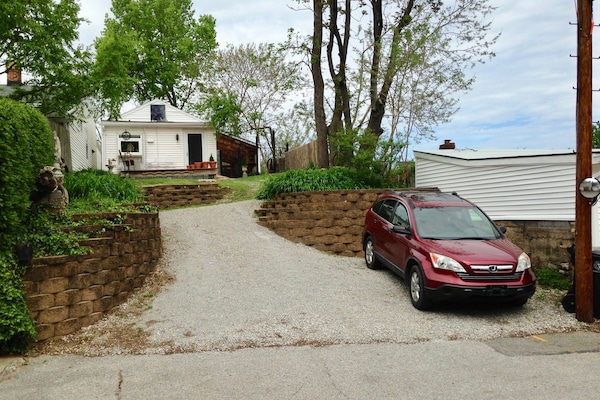 Steep gravel rise to house.