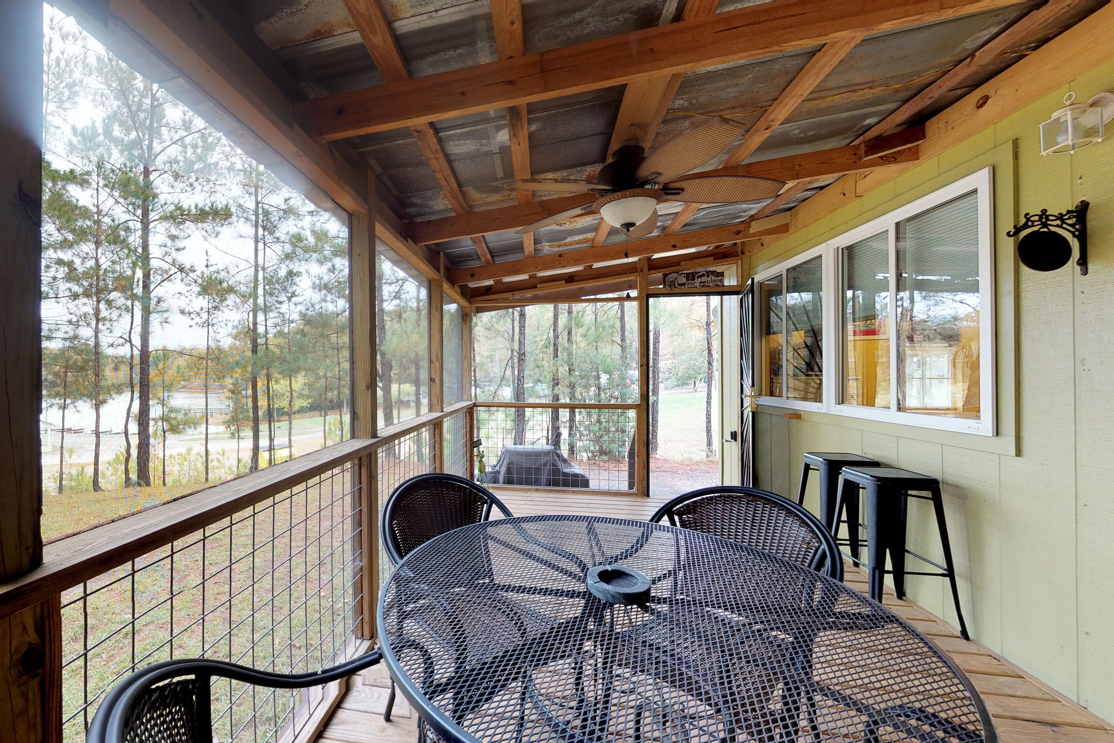 Lakefront home on 18 acres with covered deck & boat ramp access
