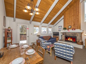 TV, fireplace, books - Cute condo w/fireplace, private decks & community pool/hot tub/sauna - Cozy Curley Bear Condo (Big Sky)