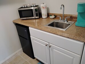 Fridge, microwave, coffee/tea maker, toaster