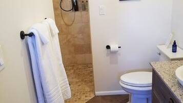 Shower, hair dryer, towels, soap