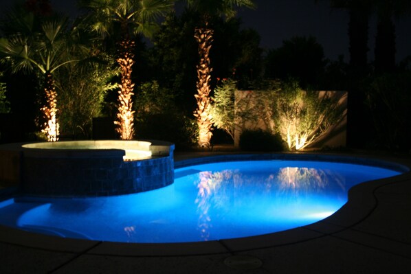 Surrounded by palm trees, this pool area offers a serene ambiance.