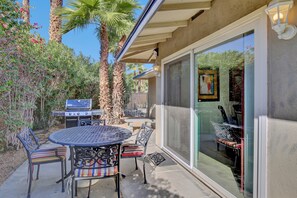 Relax outdoors with a barbecue grill and comfortable seating for four.