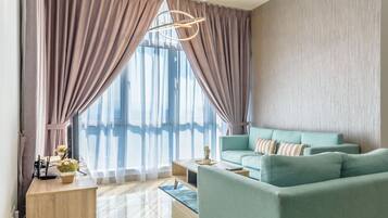 Deluxe Apartment, 3 Bedrooms | Living room | LCD TV